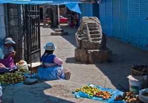 Market Scene, Chivay. Note the Inca rock that shows terracing and irrigation techniques. (2011) Photo (c) Karen Abrahamson